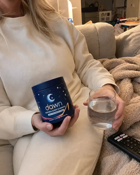 Customer on sofa holding Dawn jar and water